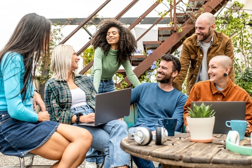Group of people chatting in an outdoor setting