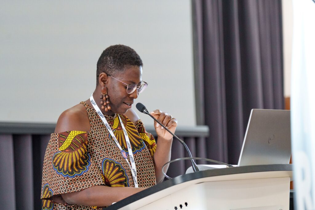 Photo of a female speaker at the Race Summit 2025